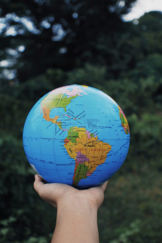 Hand holding a globe