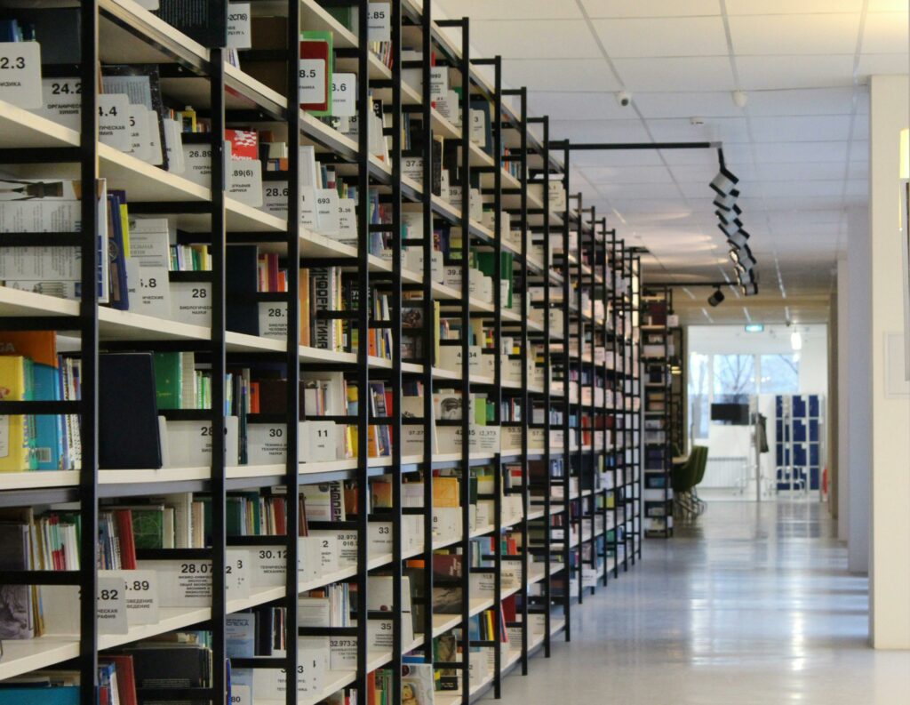 Corridor of a large library with many bookshelves